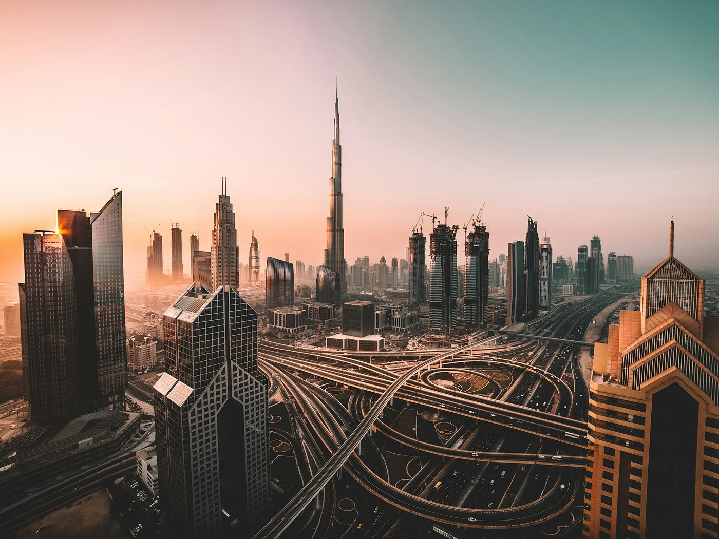 Burj Khalifa and Downtown Dubai skyline at sunset